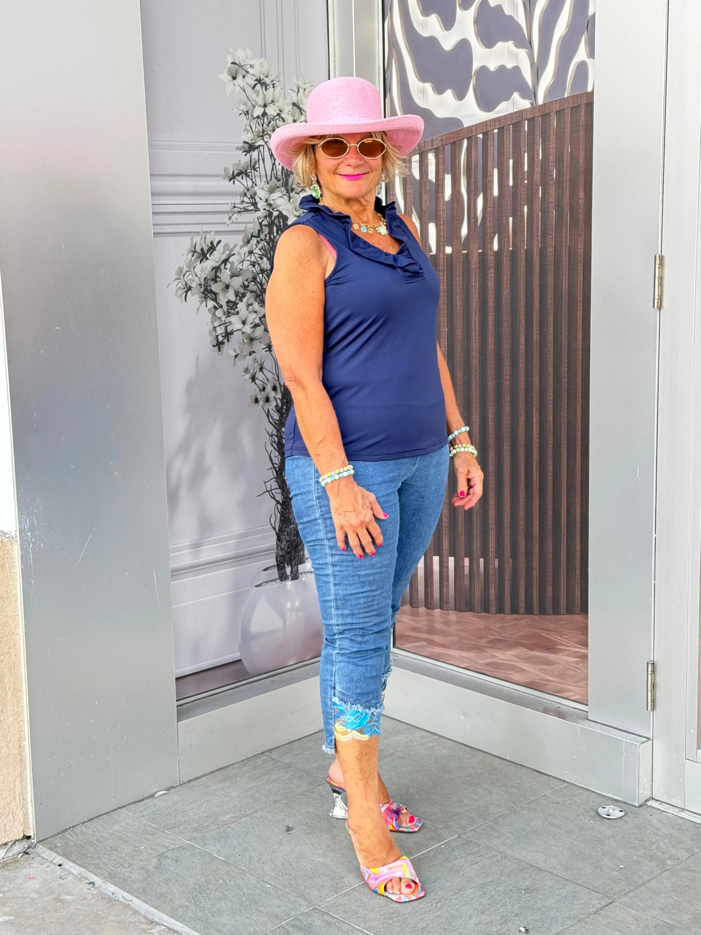 NAVY SLEEVELESS RUFFLE TOP